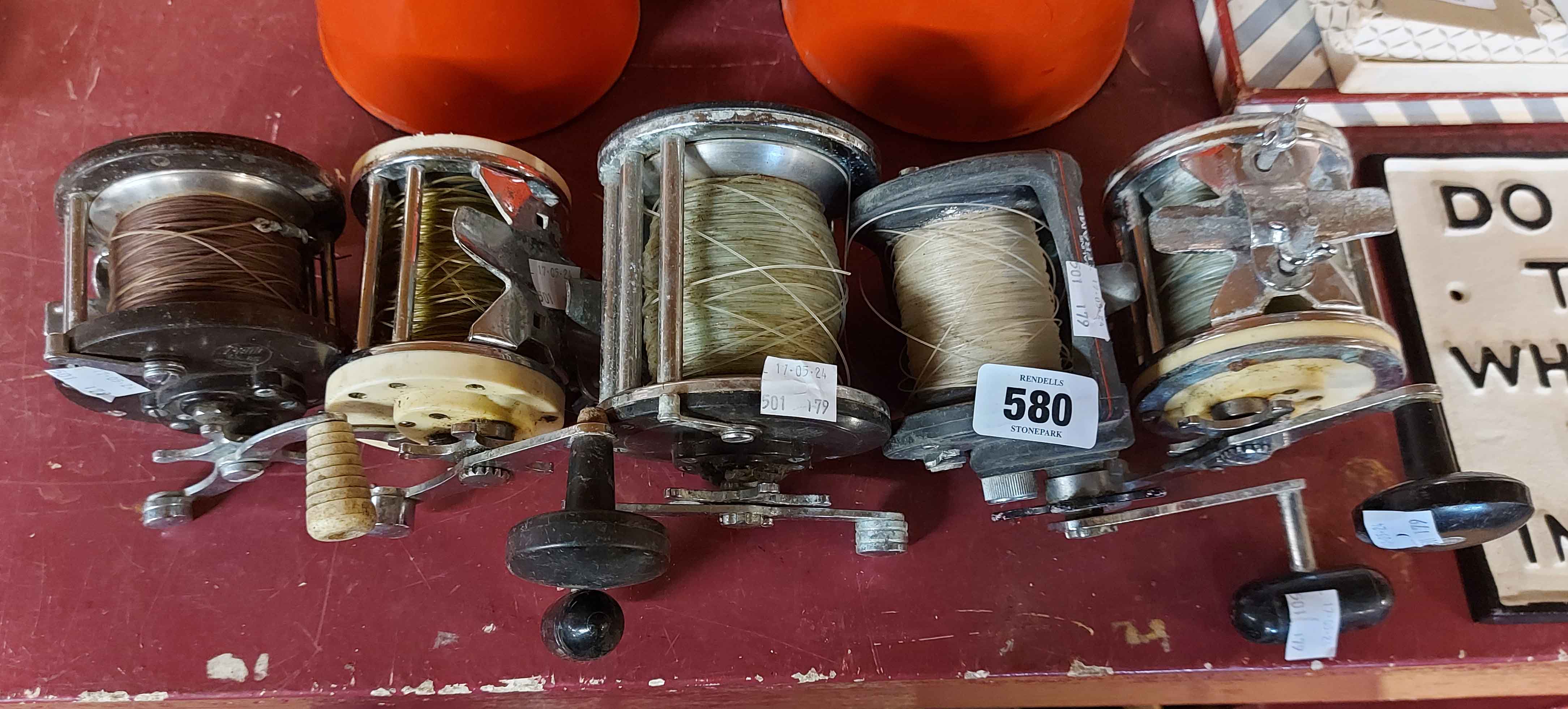 Five vintage fishing reels including Mitchell examples, etc.