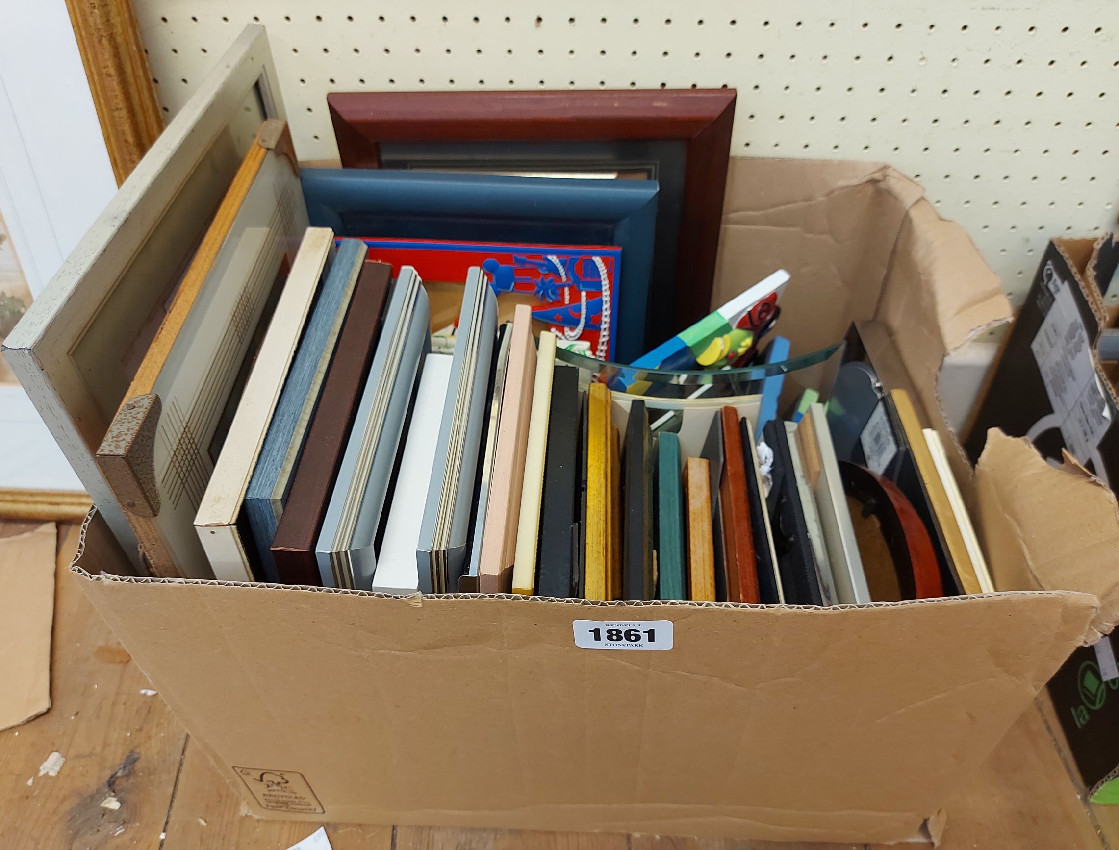 A box containing a large selection of modern small decorative picture/photograph frames - various