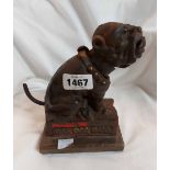 A cast iron money box of bulldog form with mouth opening action