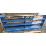 A blue painted bookcase