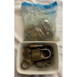 A bag containing a quantity of antique keys - sold with a tub containing assorted padlocks