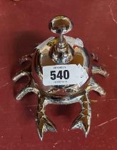 A modern desk bell in the form of a crab