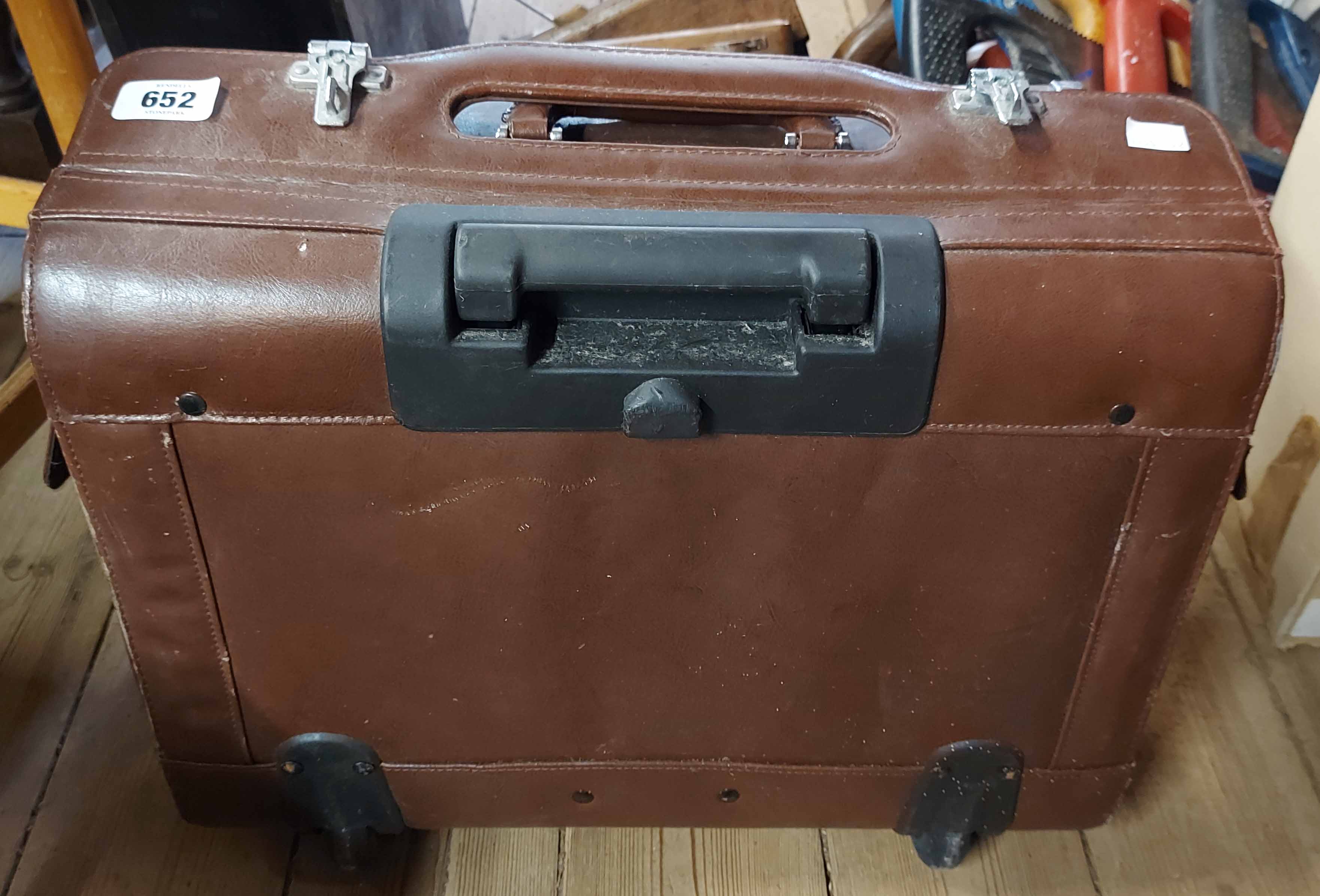 A leather briefcase on wheels