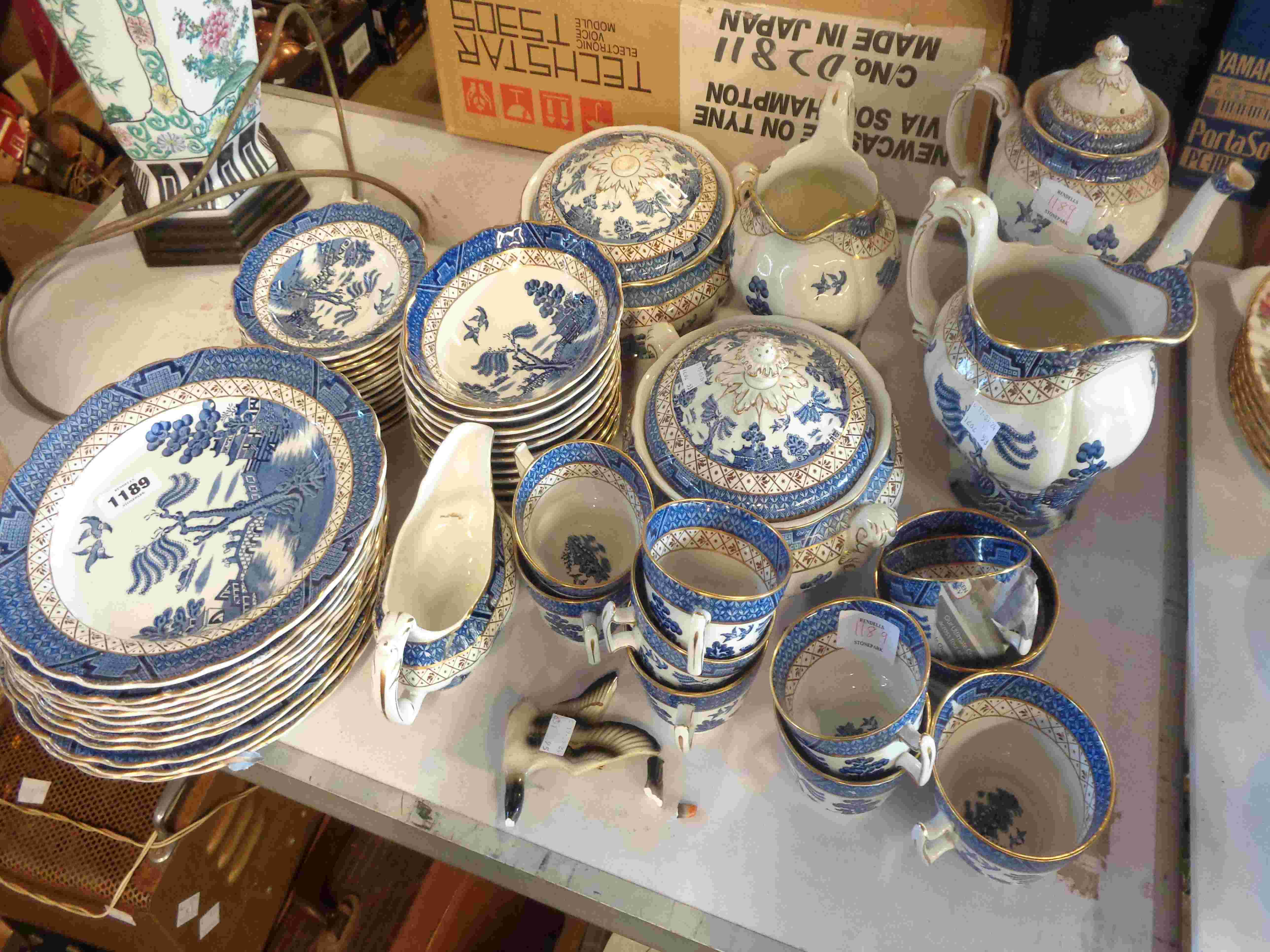 A large quantity of Booths tableware decorated in the Real Old Willow pattern including coffee