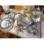 A large quantity of Booths tableware decorated in the Real Old Willow pattern including coffee