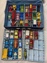 A Matchbox collector's case containing a quantity of Matchbox cars - sold with a toy multi-story