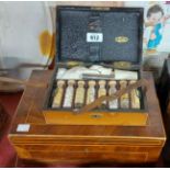 An antique wooden jewellery box - sold with a leather apothecary case containing medical bottles -