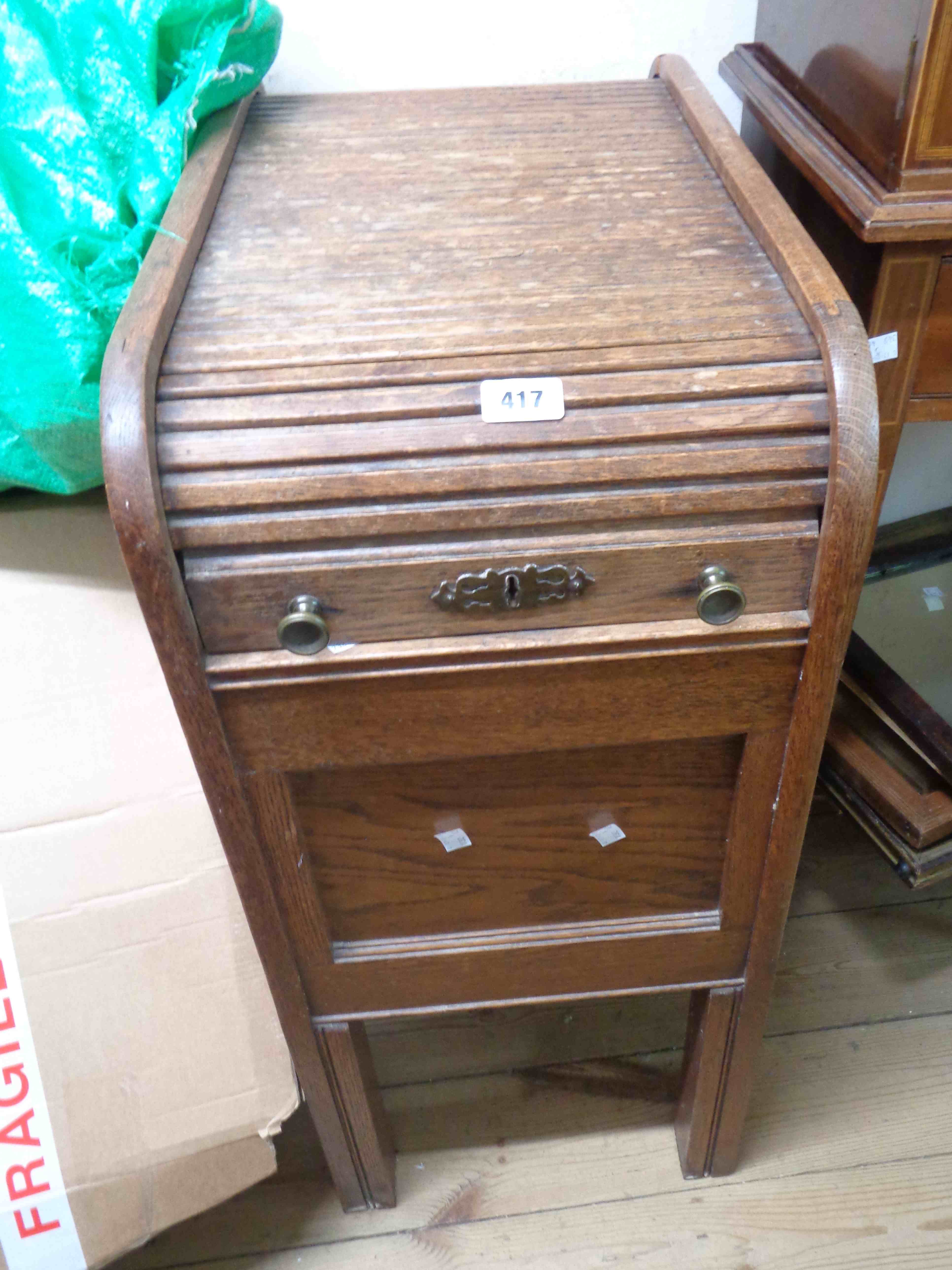 A 35cm vintage oak roll-top filing chest enclosed by a tambour, set on square legs