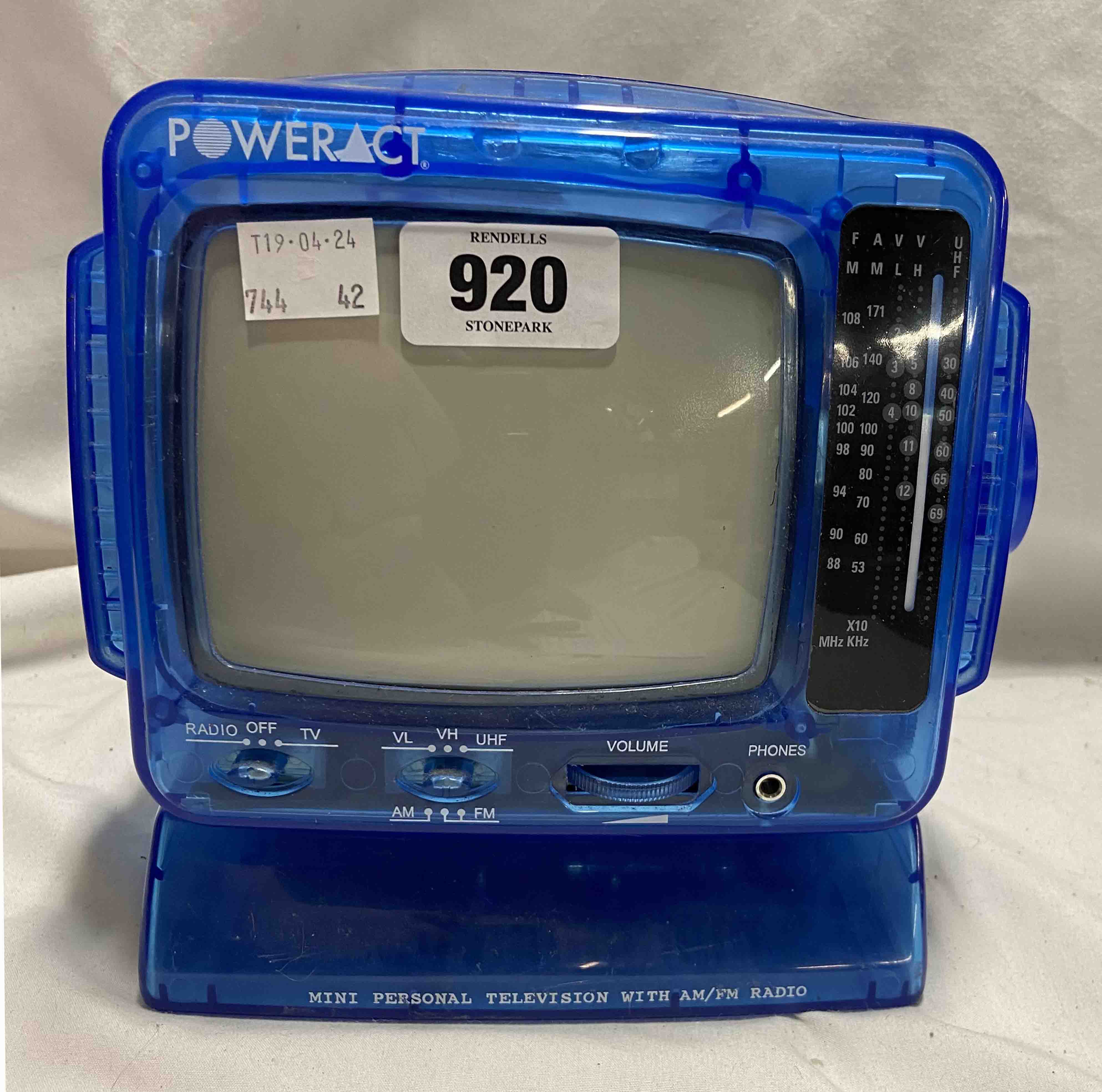 A vintage Power Act mini personal television with AM/FM radio