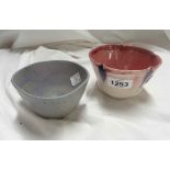 Doug Jones: a Studio Pottery bowl with pinched rim and blue painted decoration on a shaded red glaze