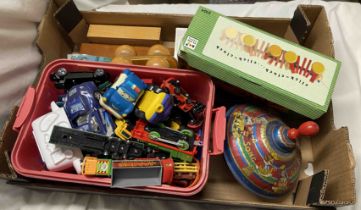 A box containing a quantity of toys including a vintage spinning top, Corgi toys, etc.