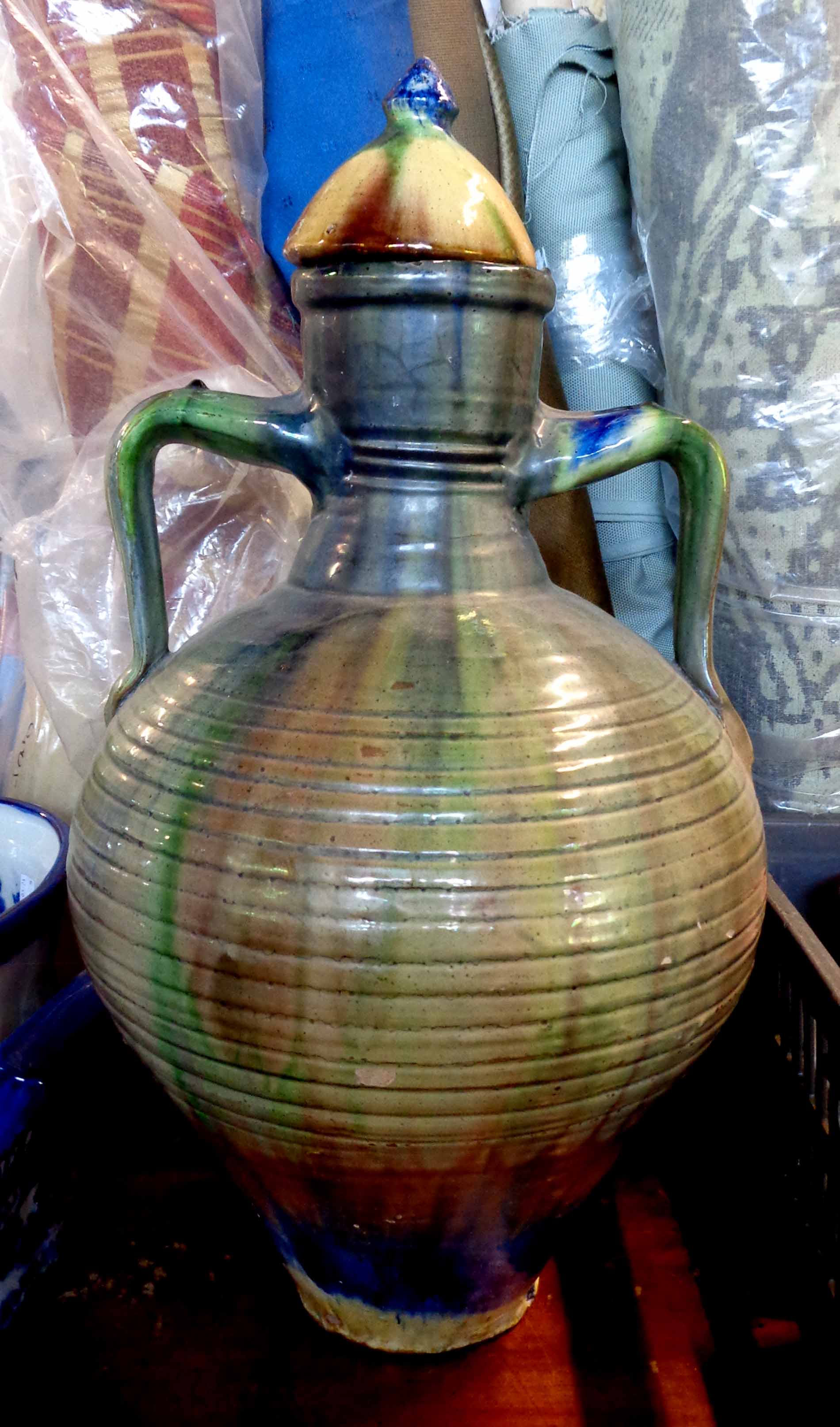 A large Belgium pottery lidded vase of bulbous two handled form with decorative coloured lead