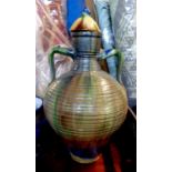 A large Belgium pottery lidded vase of bulbous two handled form with decorative coloured lead