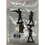 A bag containing four die cast toys of three soldiers and a knight