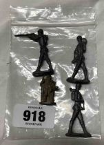 A bag containing four die cast toys of three soldiers and a knight