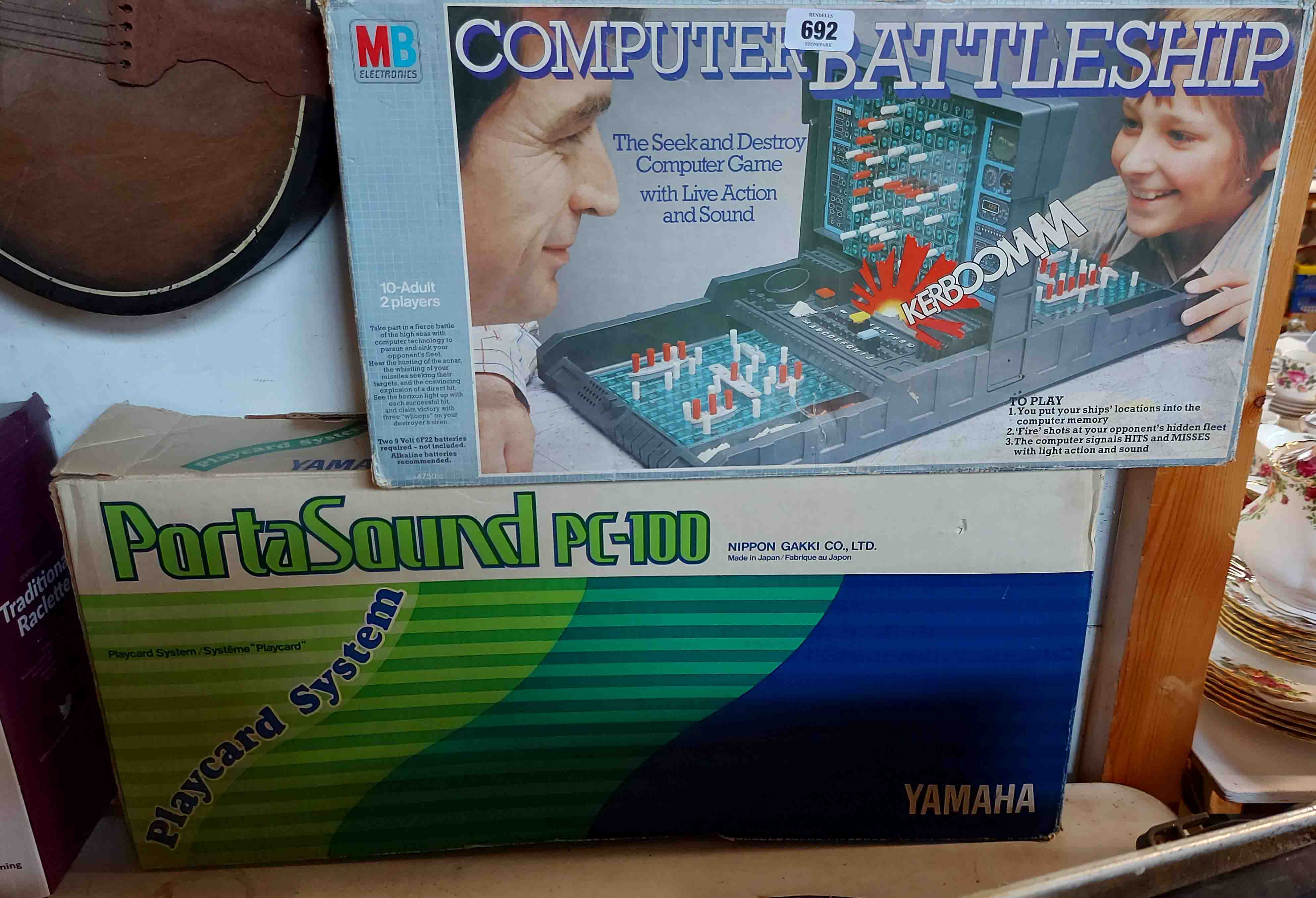 A Yamaha Portasound keyboard - sold with a MB electronic battleships game