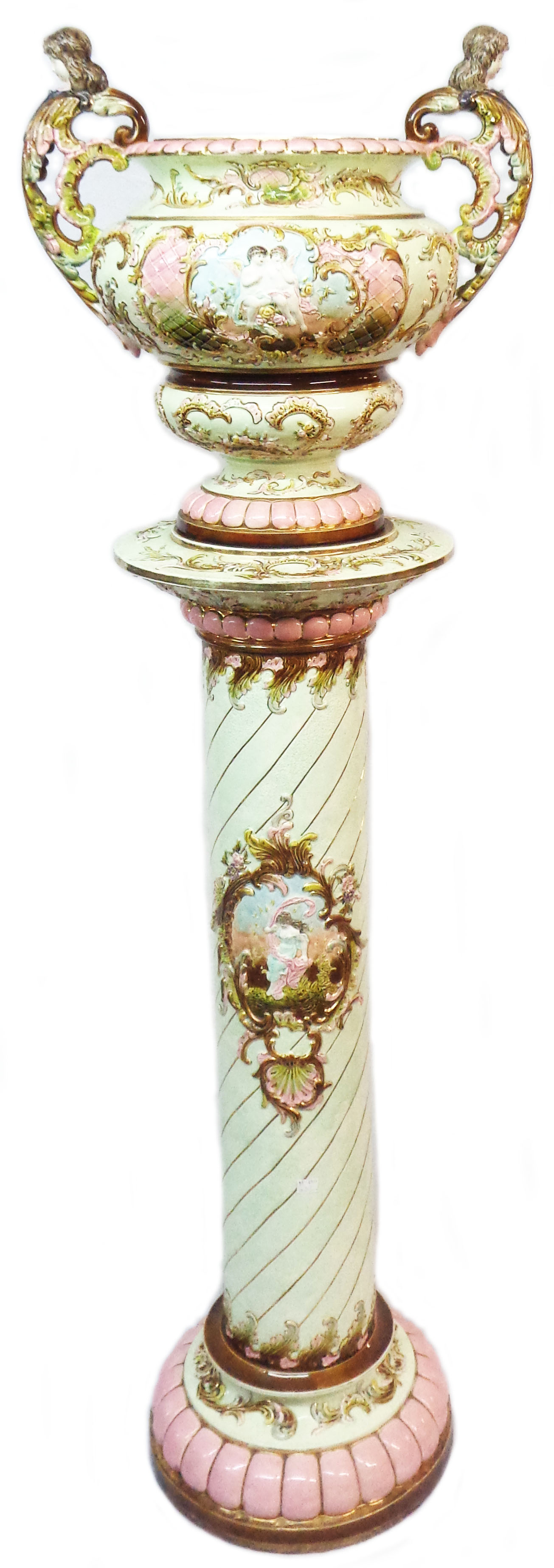 A large Austrian pottery majolica jardinière and stand, the jardinière of urn form with caryatid