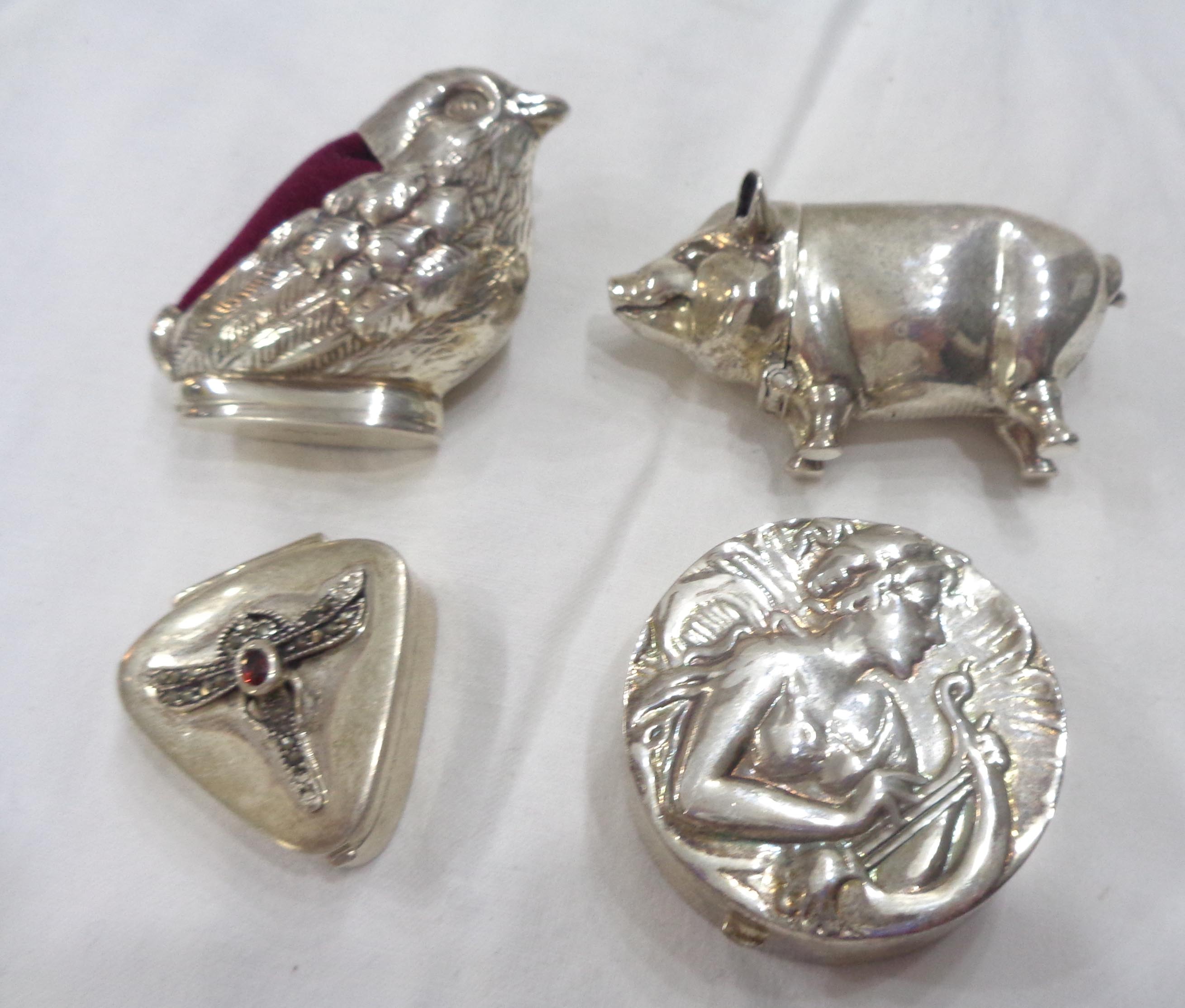 Four modern 925 white metal novelties comprising a bird pattern pin cushion, pig pattern vesta case,