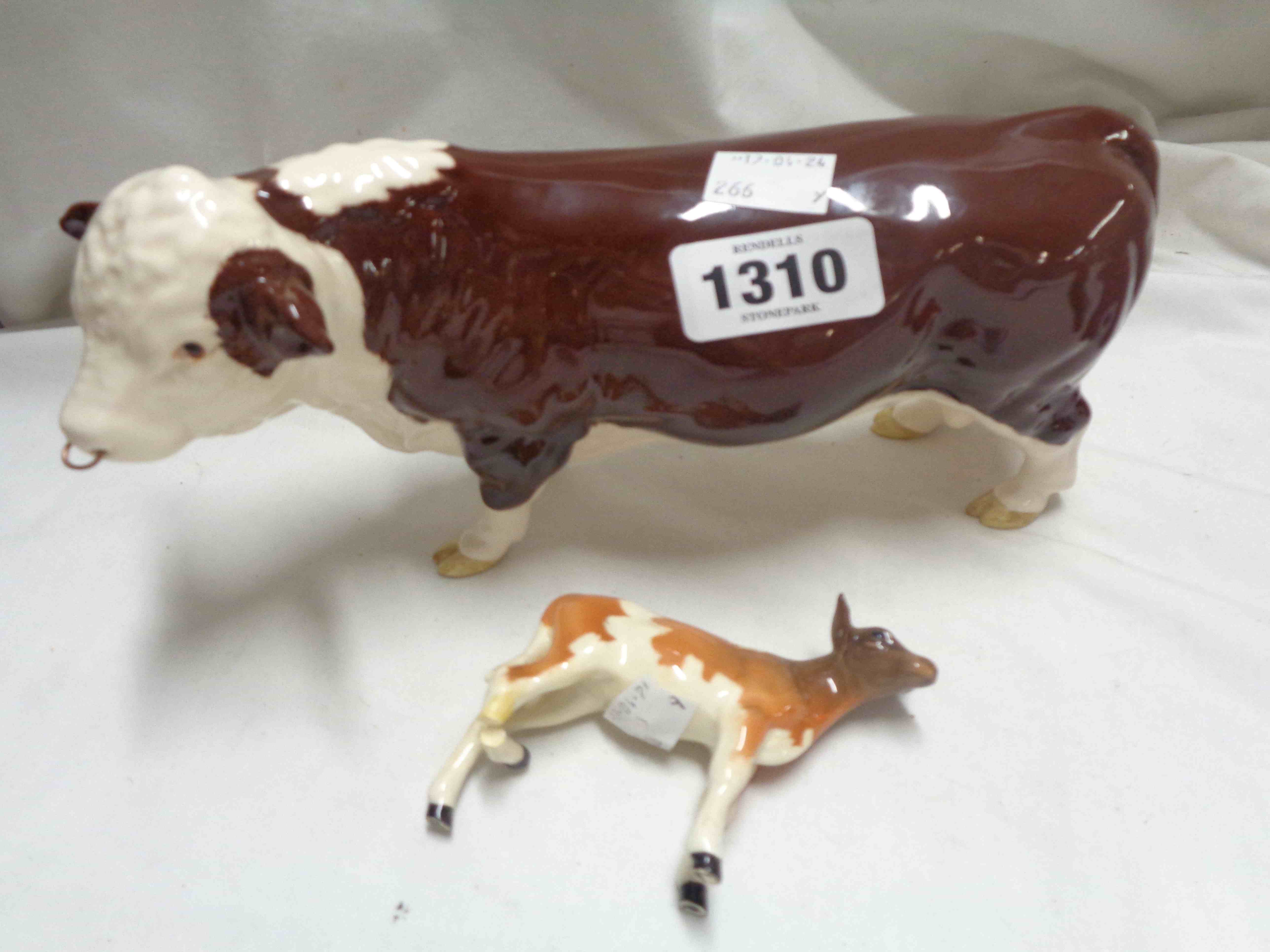 A Beswick Polled Hereford bull figurine model No. 2549A - sold with a calf model (a/f)