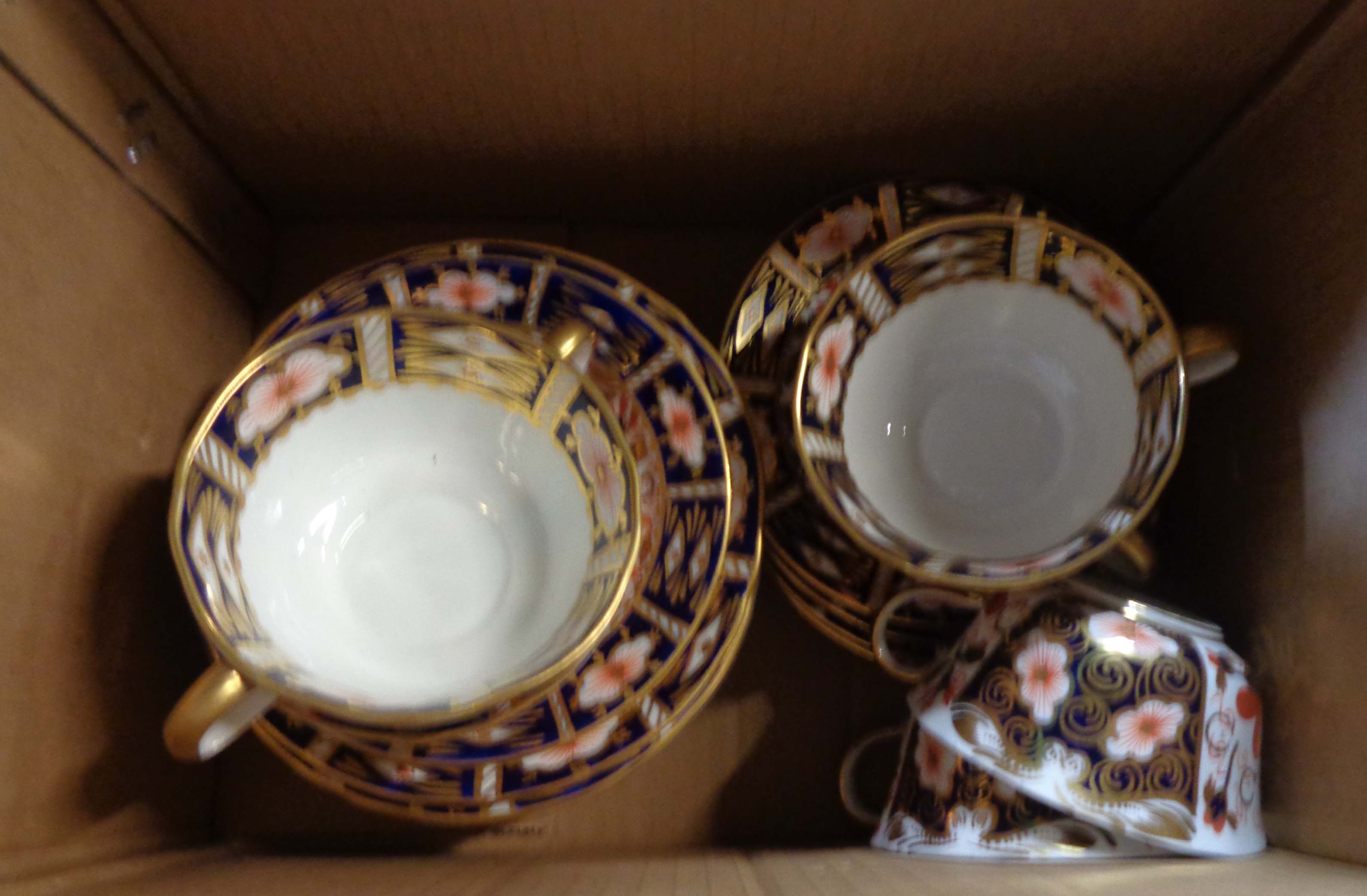 A Royal Crown Derby bone china part tea set decorated in the 2451 Imari pattern, comprising five
