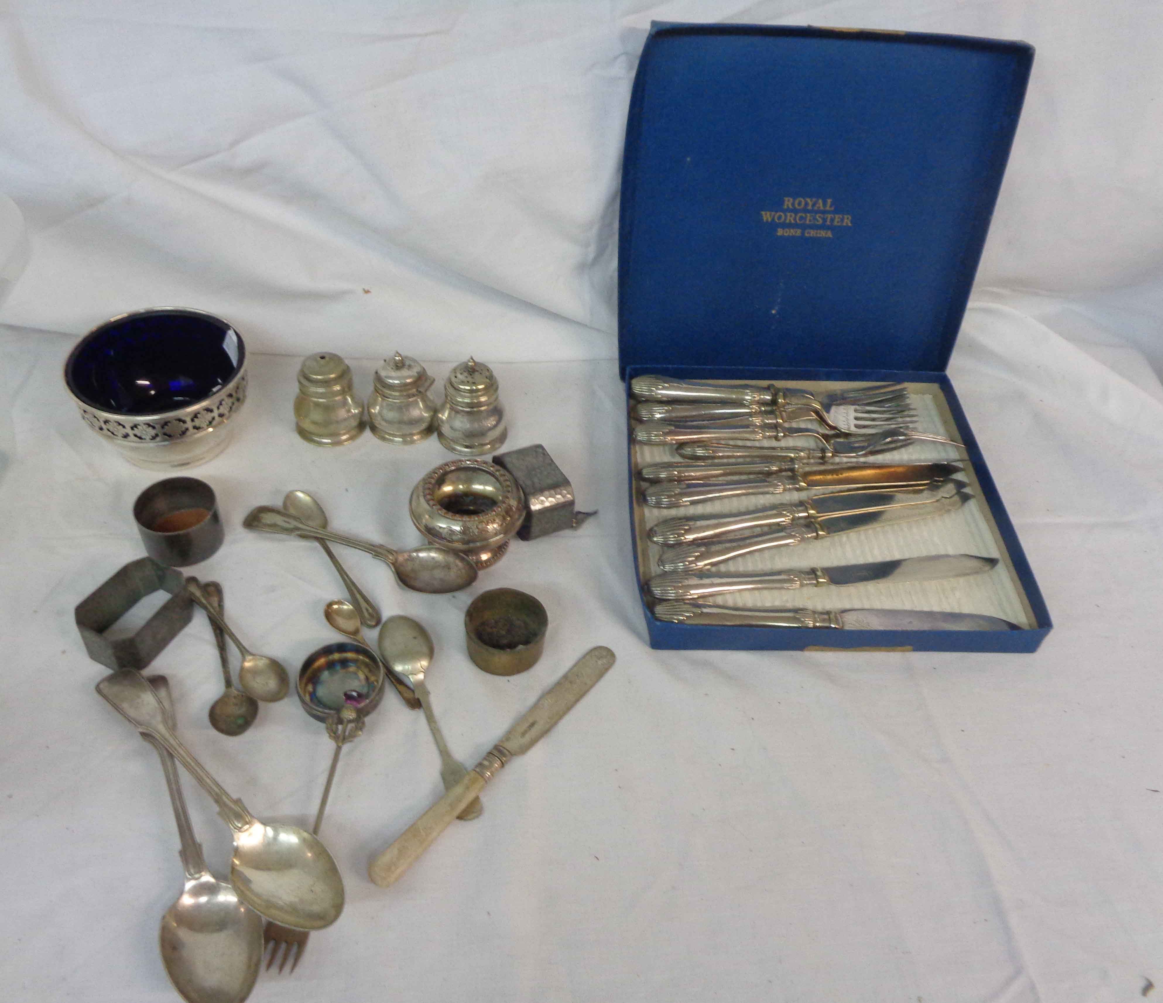 A box containing a small quantity of silver plated items including cruet set, etc.