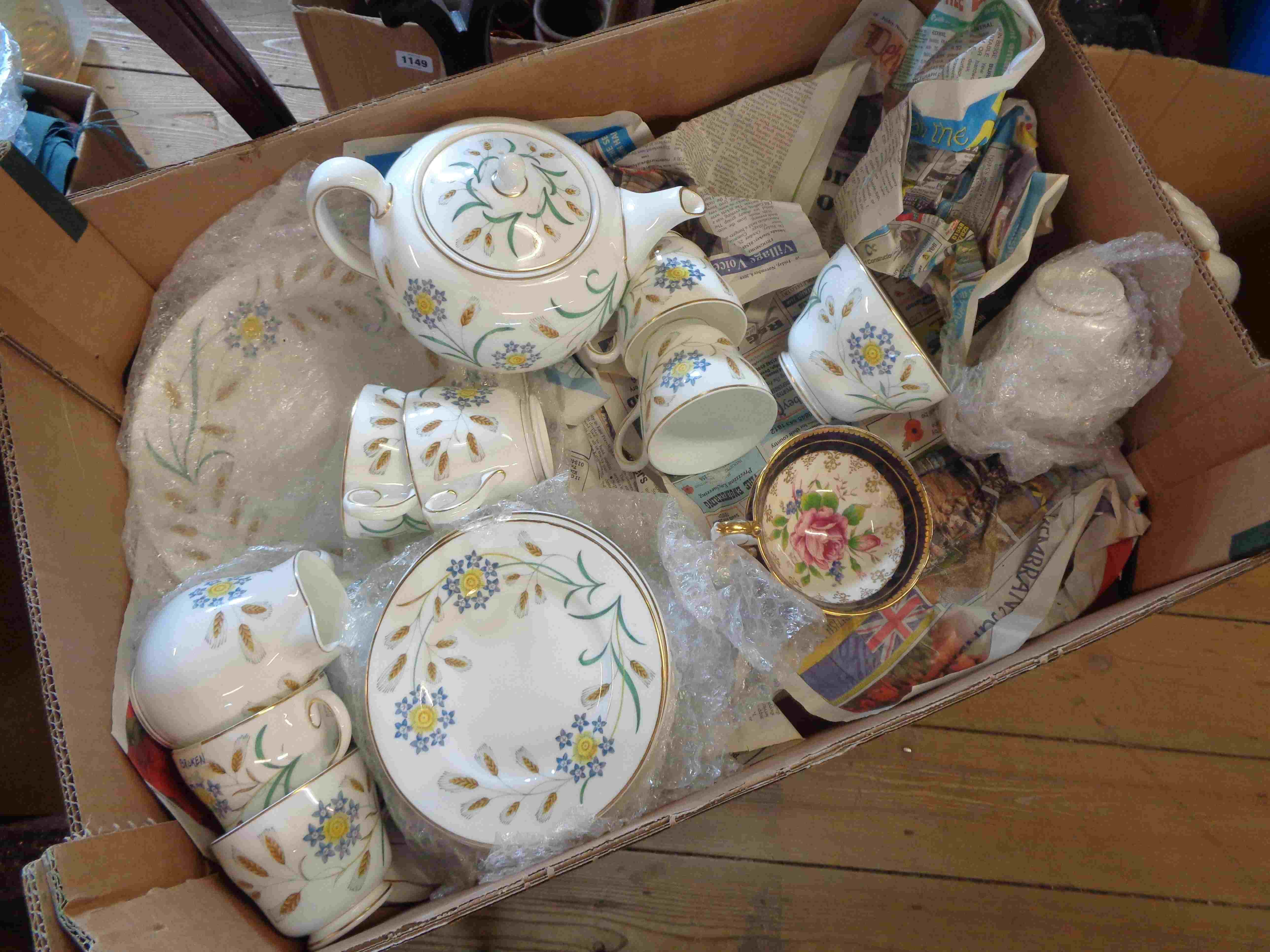 A box containing a quantity of Wedgwood bone china tableware decorated in the Wheatear pattern