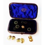 A stud case containing a pair of yellow metal oval panel cufflinks with initials, two marked 15ct.