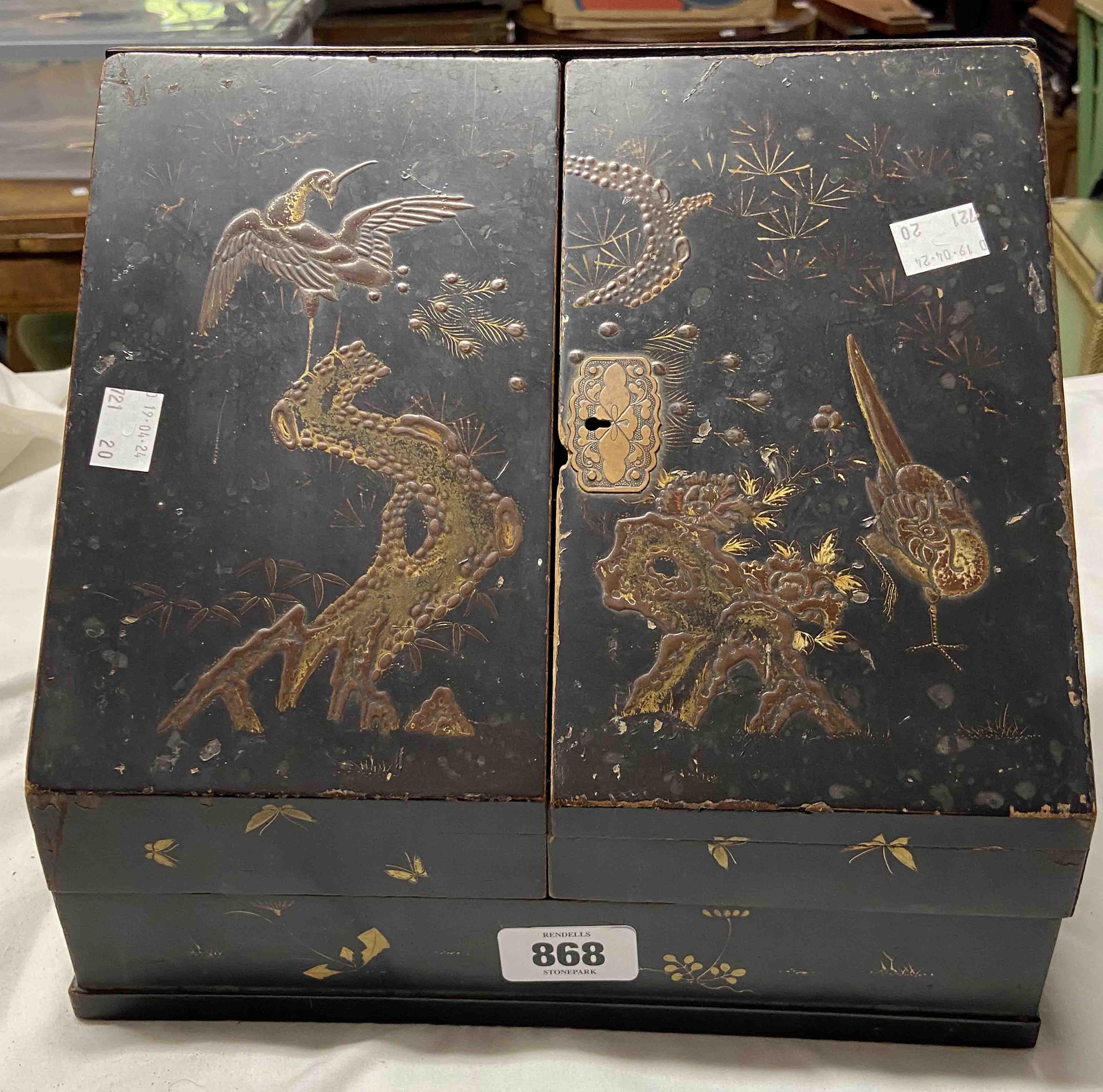 An early 20th Century oriental black lacquered stationery box with fitted interior - a/f