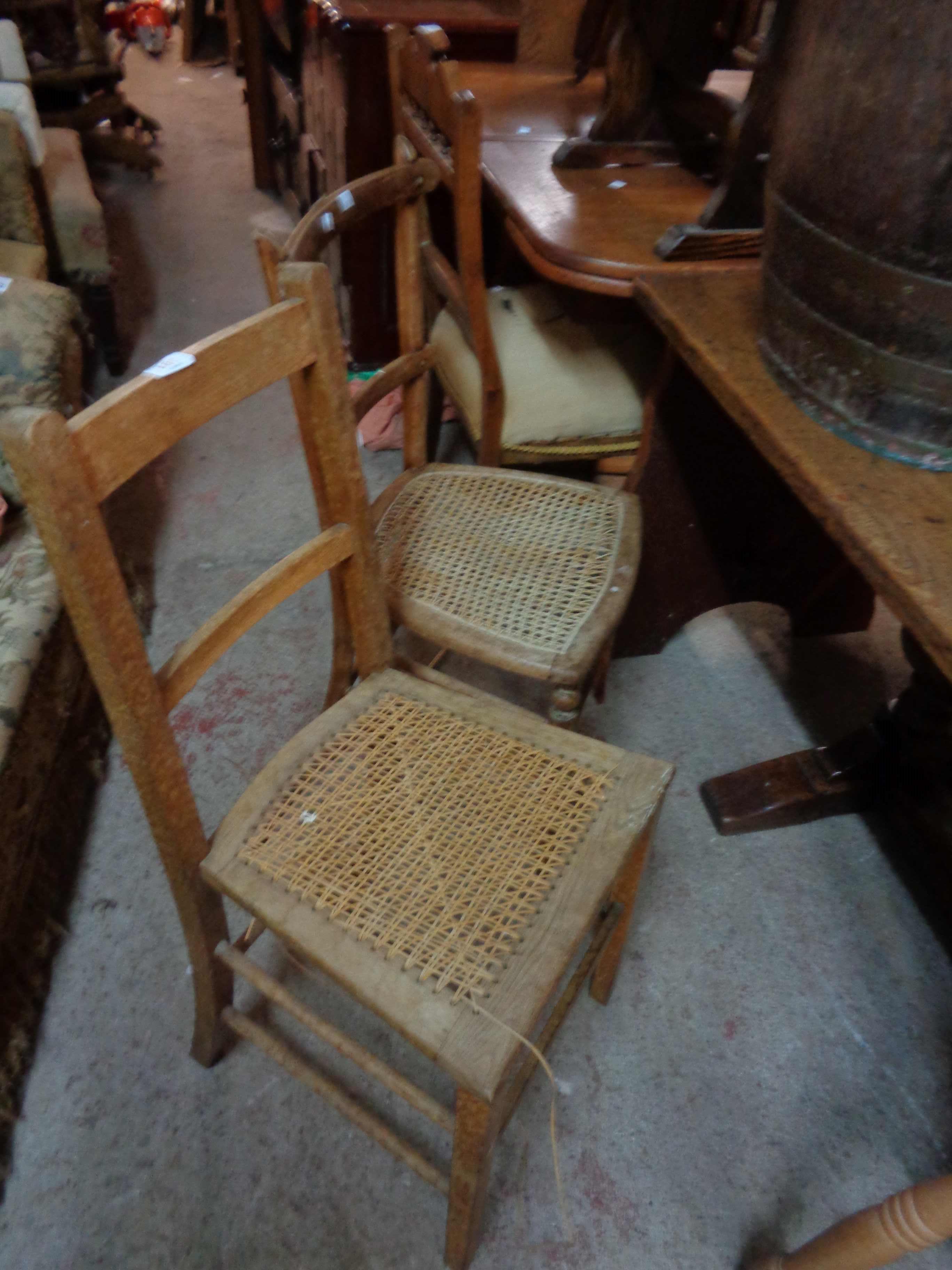 Two similar old boudoir chairs with rattan seat panels - sold with a modern stained wood elbow
