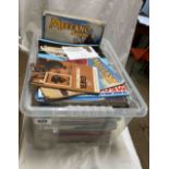 Two boxes containing a quantity of Meccano magazines, axil rods, a wood case of Meccano, etc.