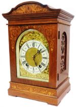 A late 19th Century inlaid mahogany cased table clock with decorative arched dial and Lenzkirch (