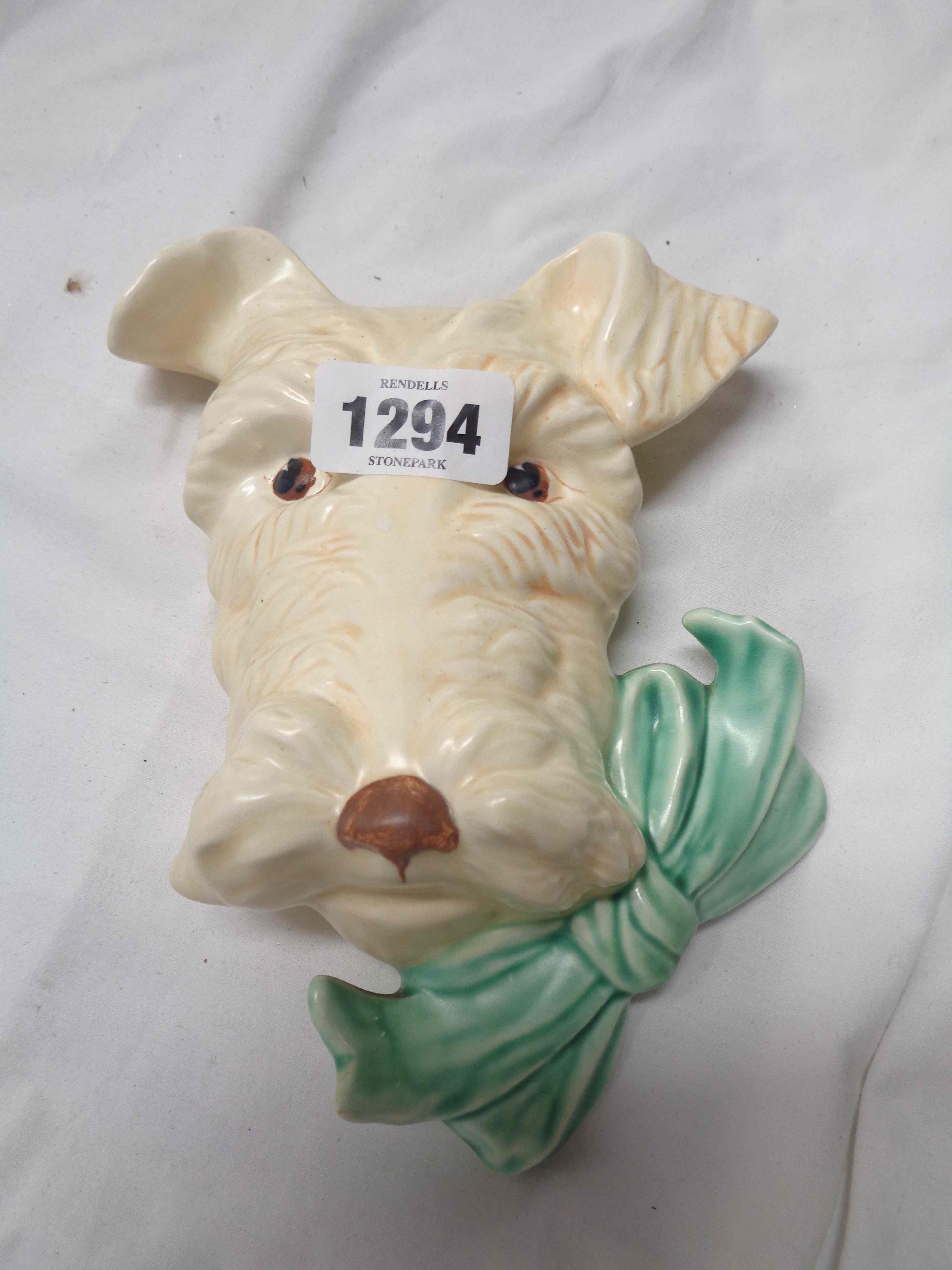 An Art Deco Beswick pottery wall mask in the form of a terrier wearing a bow tie - Model No. 301