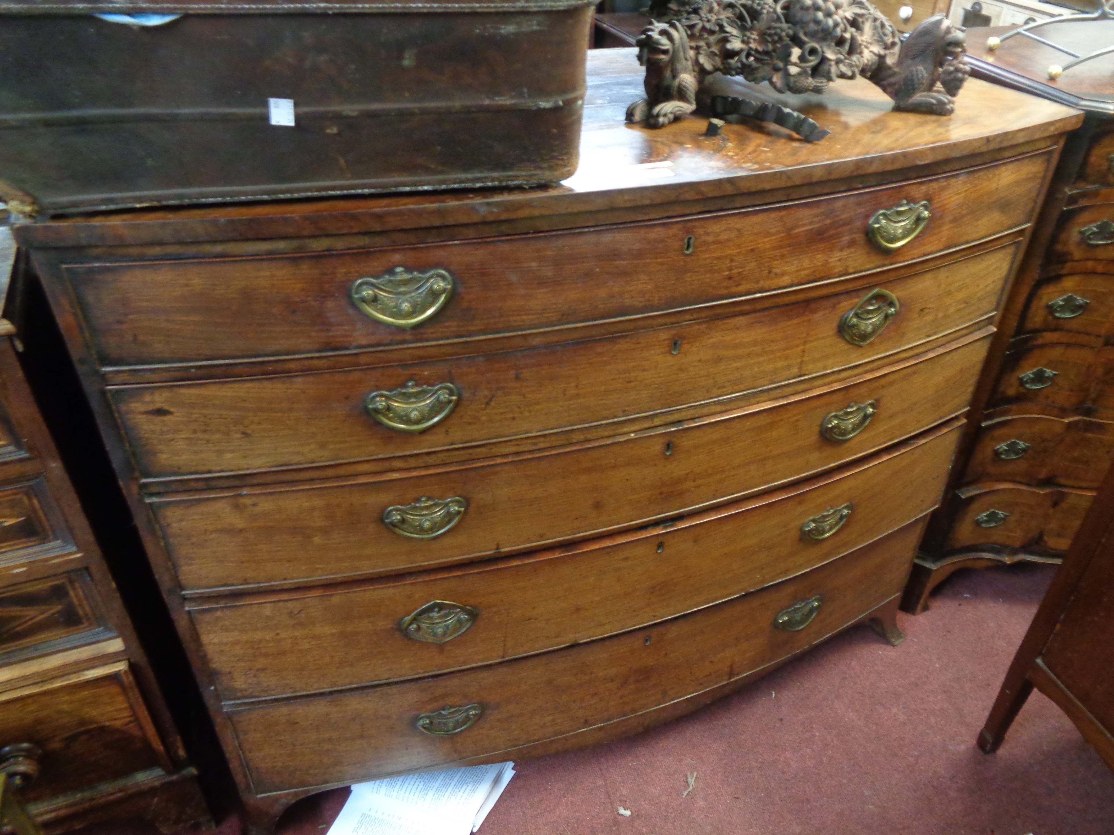 A 1.2m 19th Century mahogany bow front chest of five long graduated drawers, set on swept feet