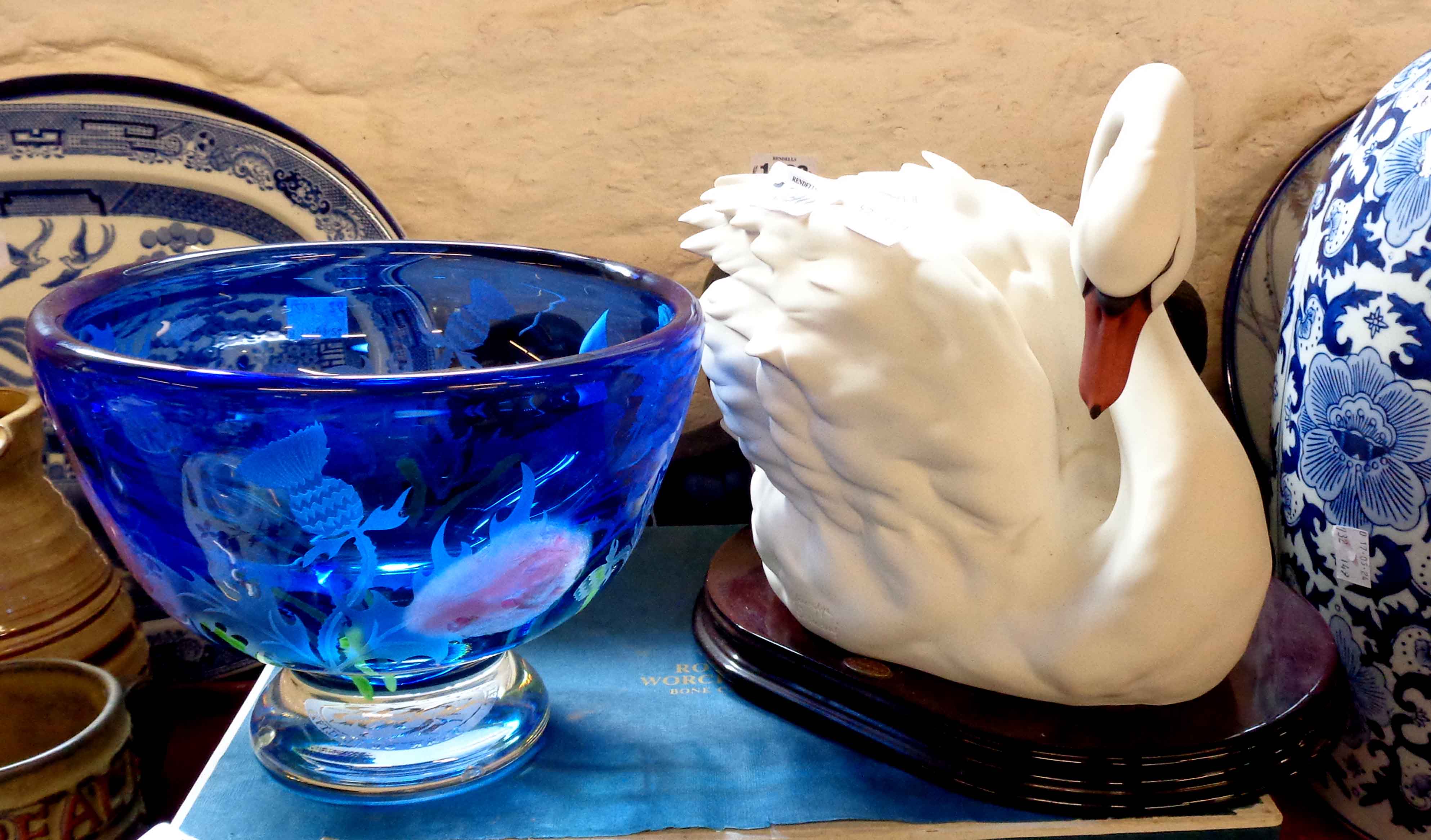 A large Caithness glass bowl with internal enamel floral and engraved thistle decoration on a