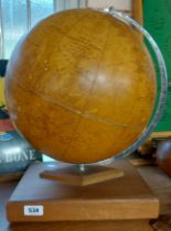 A vintage Philips Challenge globe on wooden stand