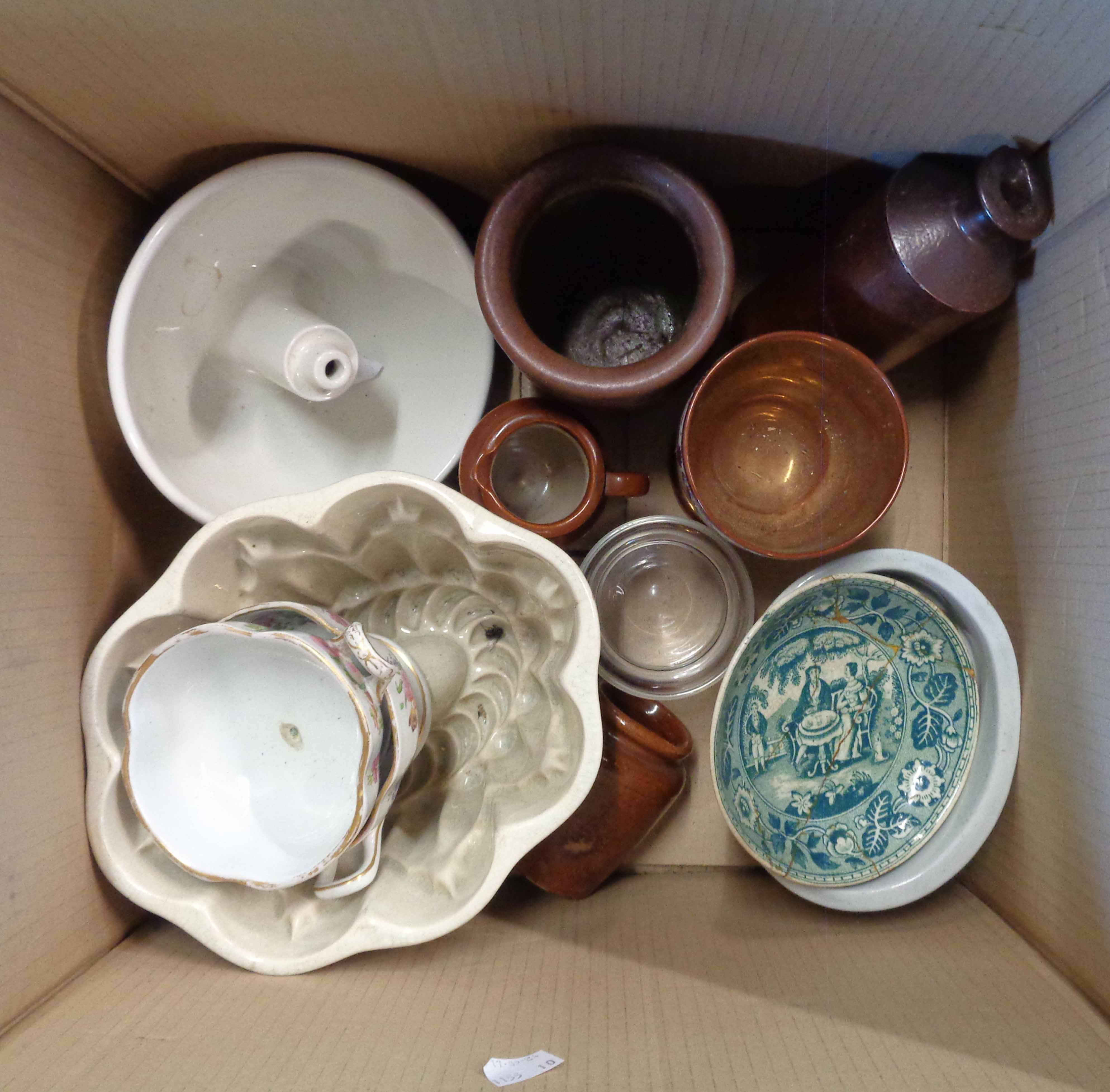 A box containing a quantity of ceramics including jelly moulds, etc.