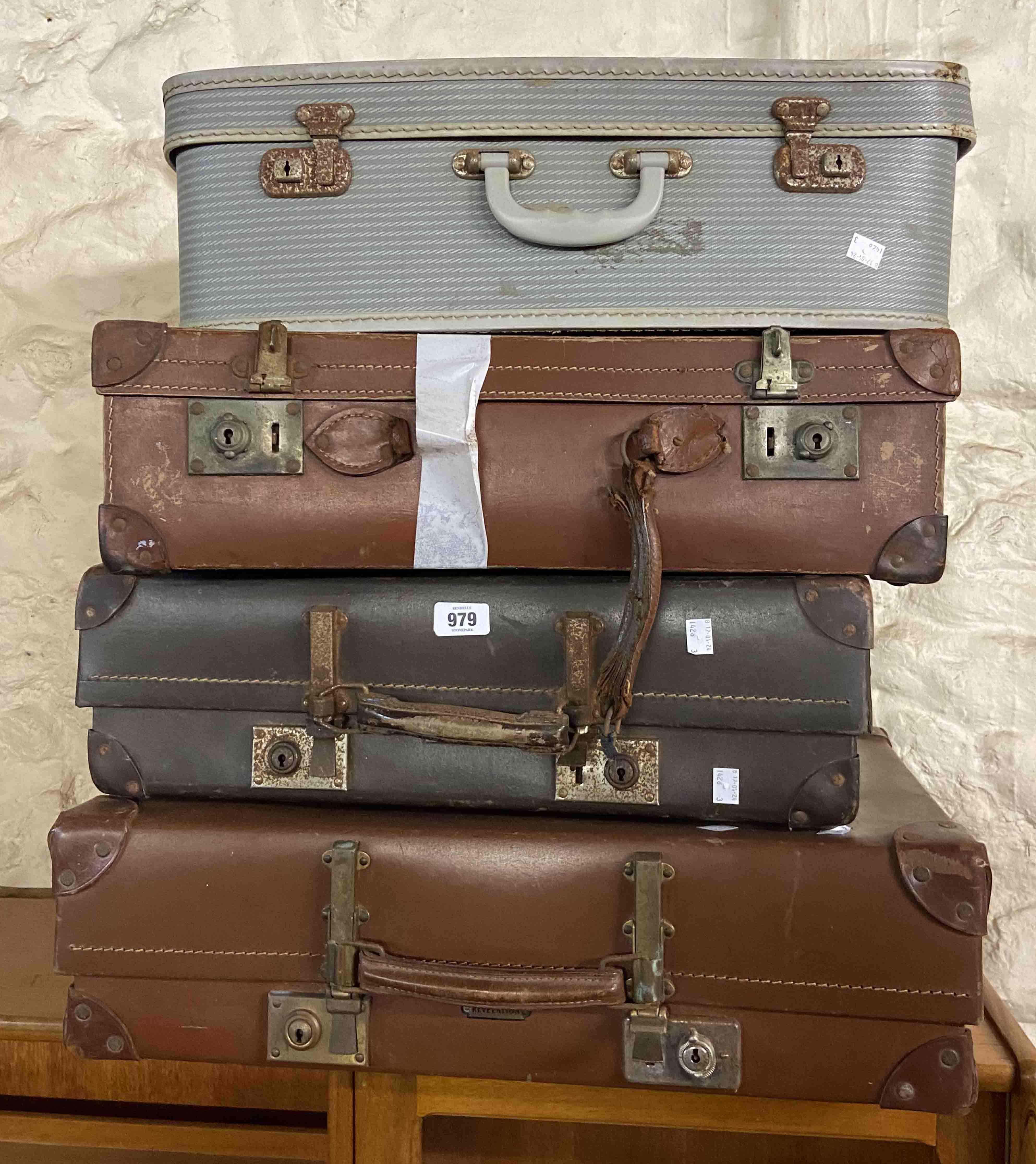 Four assorted vintage suitcases