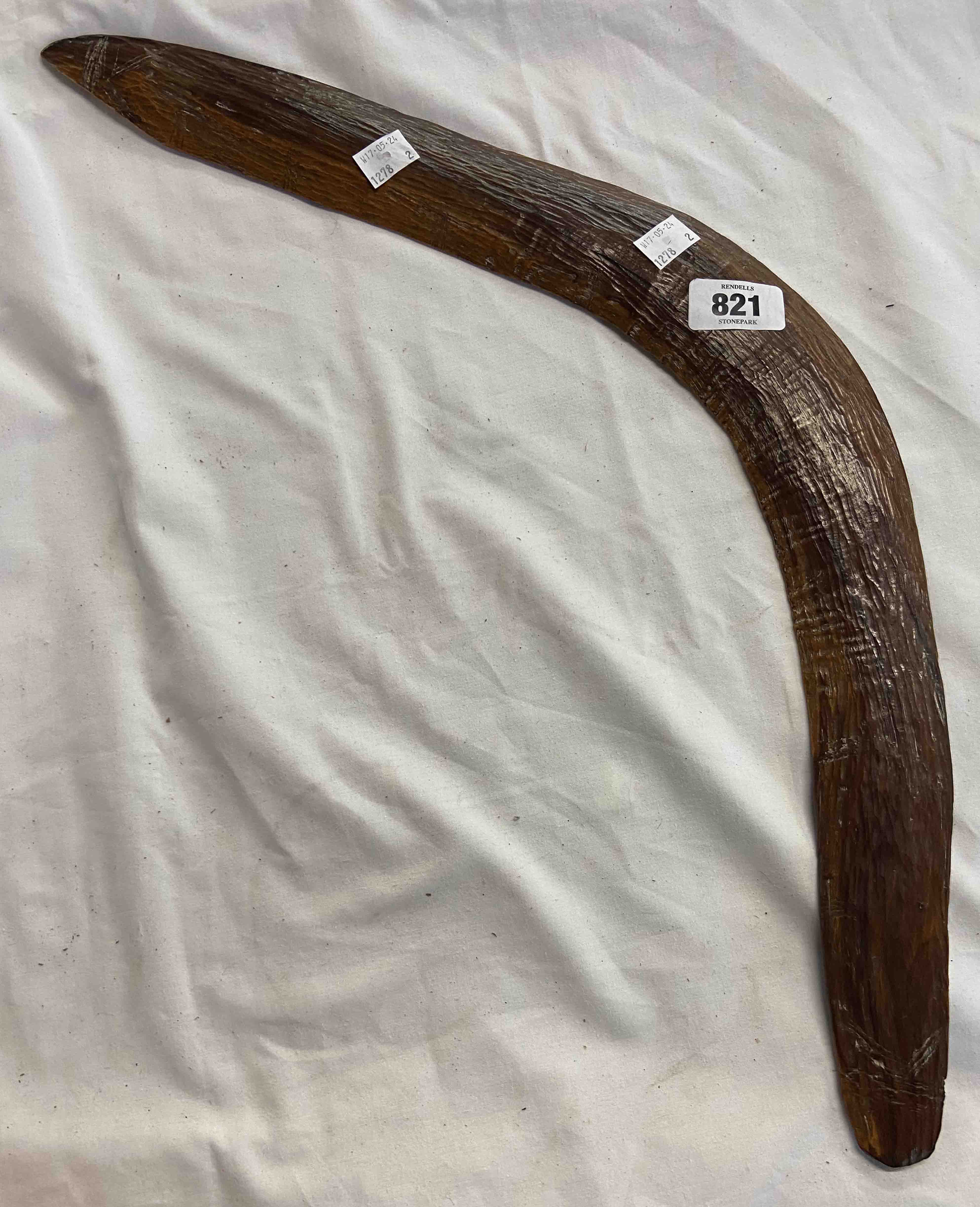 A hand carved Australian Aboriginal hunting boomerang