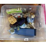 A crate containing a quantity of ceramics and other collectable items including Wedgwood tile,