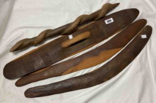 A quantity of Australian Aboriginal carved wood items consisting of two hunting boomerangs, a