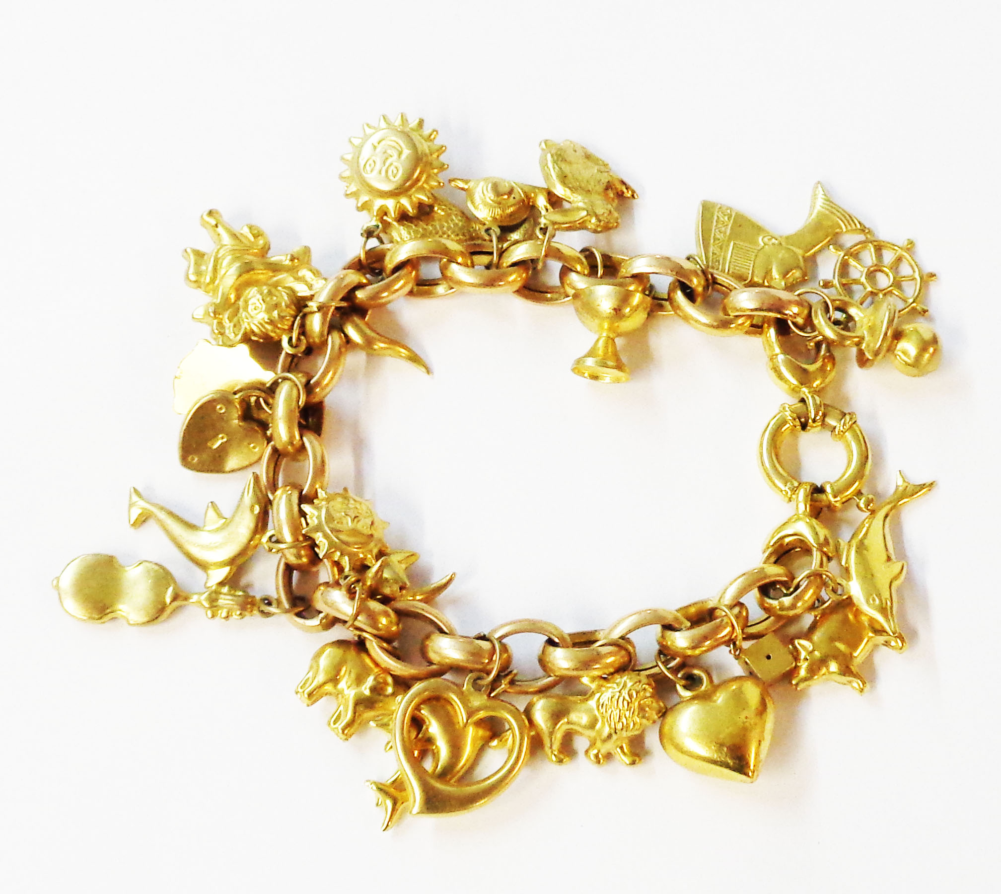 An import marked 375 (9ct.) gold oval-link bracelet, set with numerous hollow yellow metal charms