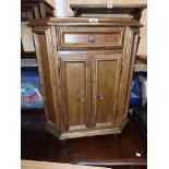 A 66cm vintage oak cabinet with canted corners, single frieze drawer and double cupboard under