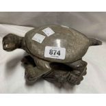 A Chinese carved soapstone turtle perched upon a rock - sold with a smaller similar elephant