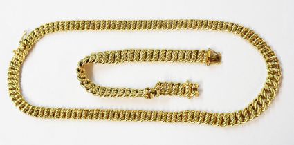 A marked 585 yellow metal multi rope twist link necklace - sold with a bracelet to match