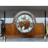 An Art Deco design stained walnut cased mantel clock with Norland eight day Westminster chiming