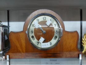 An Art Deco design stained walnut cased mantel clock with Norland eight day Westminster chiming