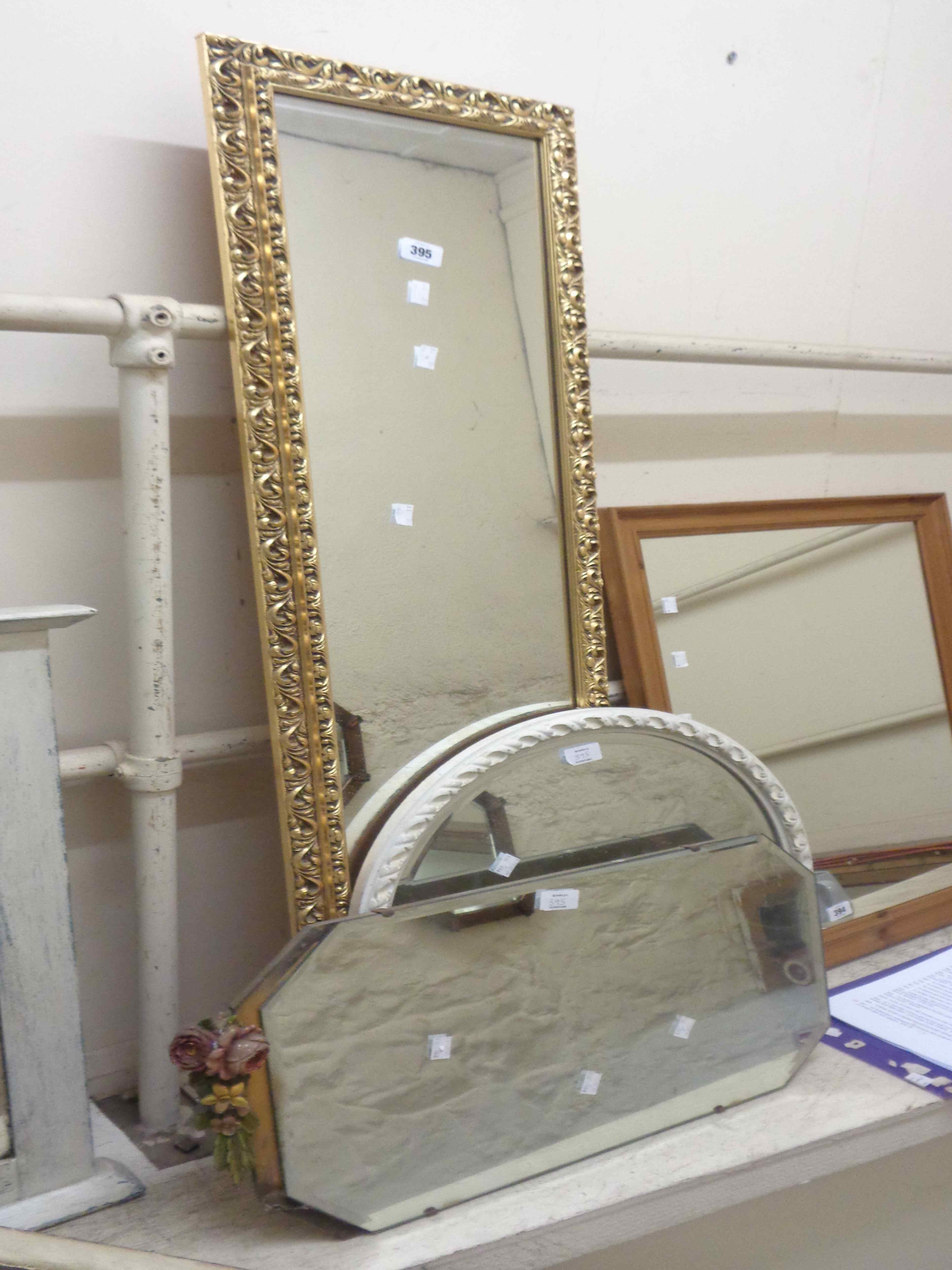 A modern gilt framed narrow oblong wall mirror - sold with a white painted framed circular mirror