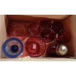 A box containing a small collection of assorted cranberry glassware including wine glasses, sugar