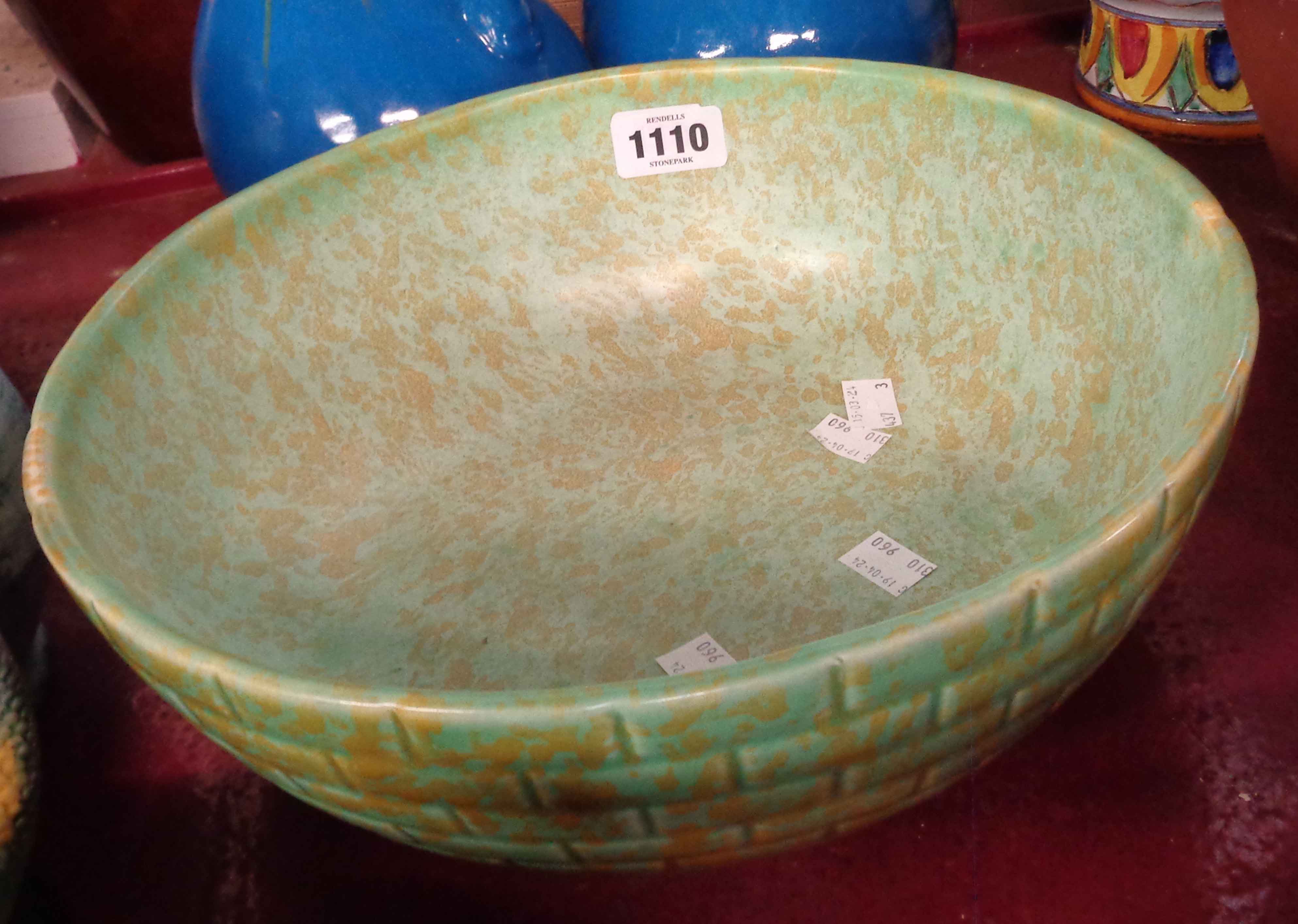 A large Wade Heath Flaxman pottery bowl with moulded 'brick' decoration and a mottled green glazed