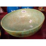 A large Wade Heath Flaxman pottery bowl with moulded 'brick' decoration and a mottled green glazed